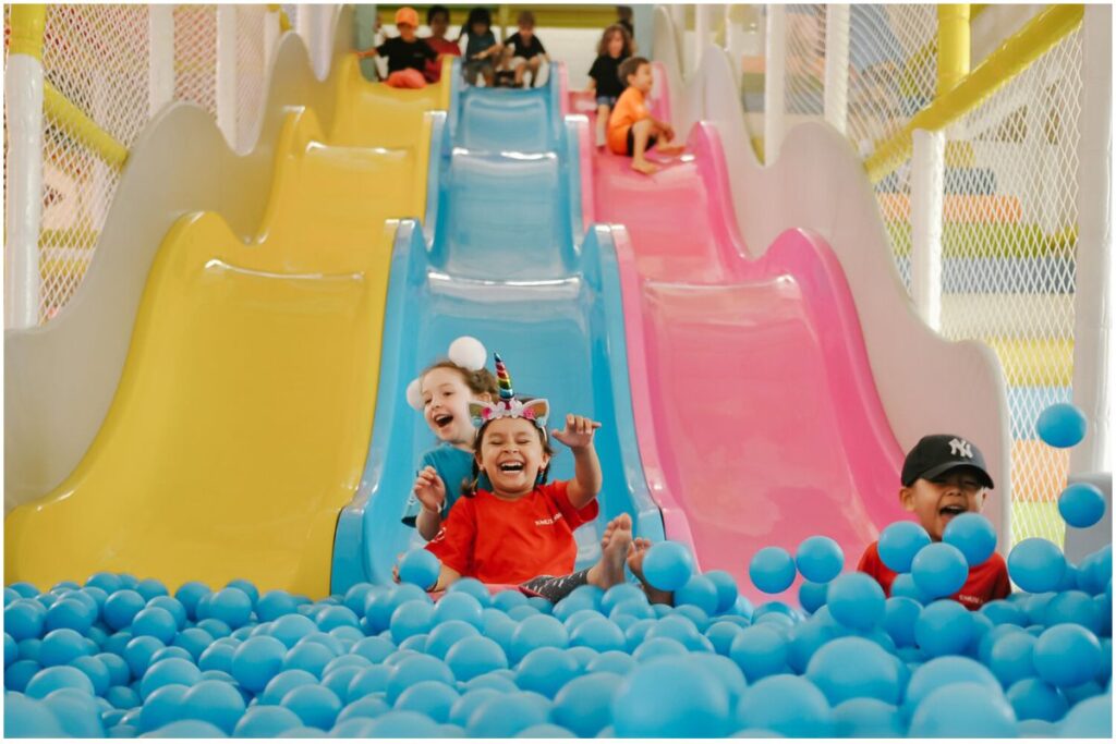 kids playing slide at the playground