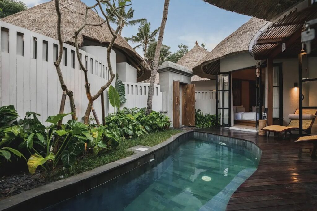 Private boutique hotel villa in Bali with small pool, garden, and open bedroom area.
