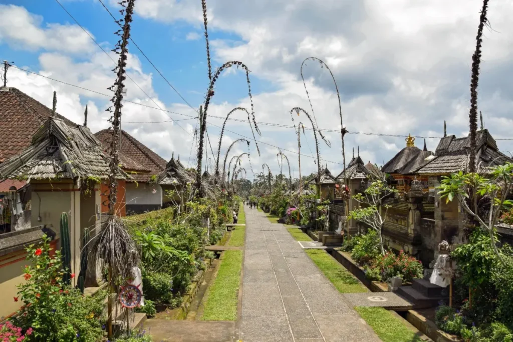 Walking path in Penglipuran Village Bali with traditional houses and cultural scenery.