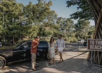 Couple arrives by private car for a luxury Bali travel experience with personal service and exclusive destinations.